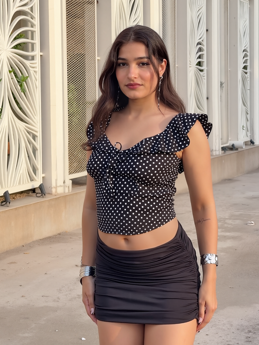 Mira Polka Dot Flounce Neck Top In Black